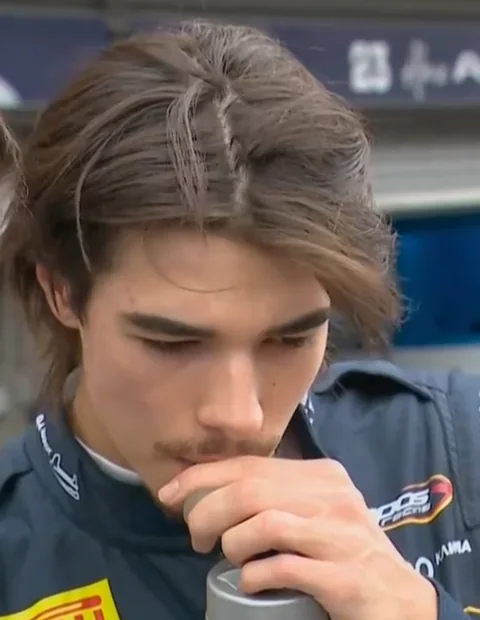 Head-and-shoulders portrait of Nikola Tsolov in his Campos Racing suit
